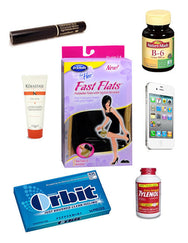 assortment of purse items including gum, mascara, and vitamins