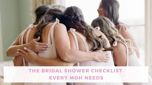 The Bridal Shower Checklist Every Maid of Honor Needs. Image shows women engaged in a group hug.
