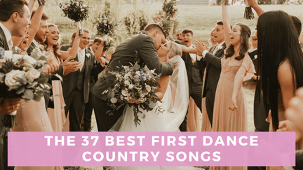 Couple kissing at wedding surrounded by bridal party