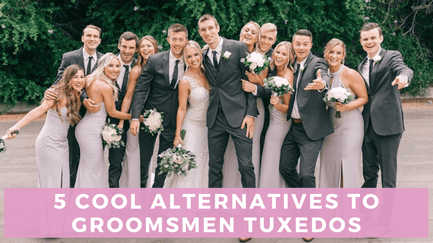 Groomsmen in gray suits posing with bridesmaids in purplish pink dresses