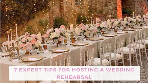 wedding rehearsal table setting with centerpieces and string lights