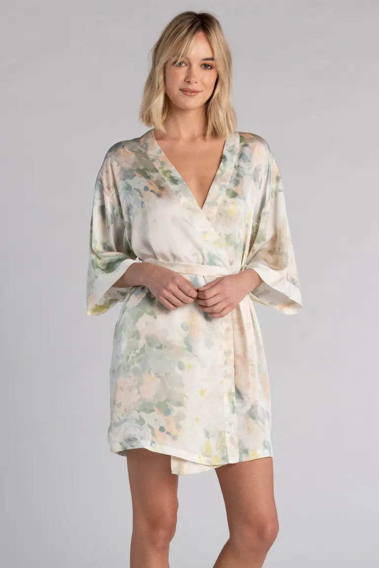Blonde model wearing a printed charmeuse robe with detachable sash. Hem above the knee.